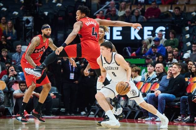 November 23, 2025, Toronto, On, Canada: Brooklyn Nets Egor Do«min (8) drives past Toronto Raptors Scottie Barnes (4) during first half NBA, Basketball Herren, USA basketball action in Toronto, on Sunday, Nov. 23, 2025. Canada News - November 23, 2025 - ZUMAc35_ 20251123_zaf_c35_113 Copyright: xSammyxKoganx