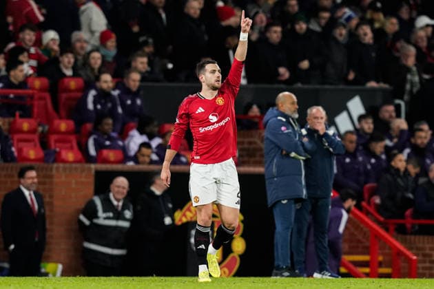 Manchester, England, 4th December 2025. Diogo Dalot of Manchester United, ManU celebrates his goal to make it 1-0 during the Manchester United vs West Ham United Premier League match at Old Trafford, Manchester. Picture credit should read: Andrew Yates Sportimage EDITORIAL USE ONLY. No use with unauthorised audio, video, data, fixture lists, club league logos or live services. Online in-match use limited to 120 images, no video emulation. No use in betting, games or single club league player publications. SPI_042_AY_MANUTD_WESTHAM SPI-4345-0043