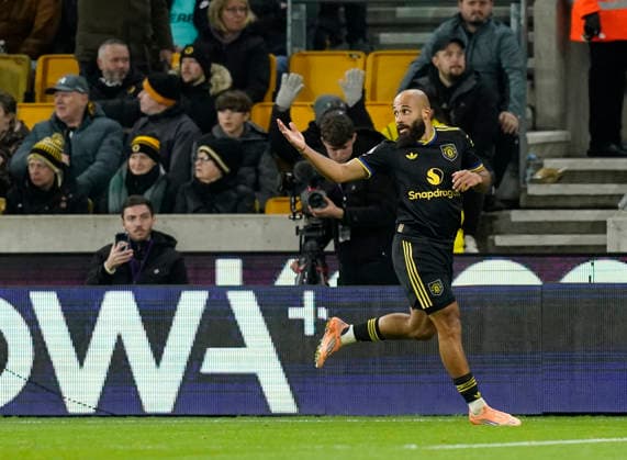Wolverhampton, England, 8th December 2025. Bryan Mbeumo of Manchester United, ManU (c) celebrates scoring their second goal during the Wolverhampton Wanderers vs Manchester United Premier League match at Molineux, Wolverhampton. Picture credit should read: Andrew Yates Sportimage EDITORIAL USE ONLY. No use with unauthorised audio, video, data, fixture lists, club league logos or live services. Online in-match use limited to 120 images, no video emulation. No use in betting, games or single club league player publications. SPI_073_AY_Wolves_Man_Utd SPI-4356-0075