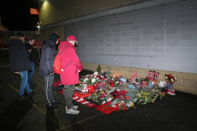 Memorial flowers for Charlton Athletic fan Norman Barker, known as Headphones Norm who died during the home match against Portsmouth causing the match to be abandoned. Charlton Athletic v Middlesbrough, Sky Bet Championship, Football, The Valley, London, UK - 09 Dec 2025London The Valley United Kingdom EDITORIAL USE ONLY No use with unauthorised audio, video, data, fixture lists, club league logos or live services. Online in-match use limited to 120 images, no video emulation. No use in betting, games or single club league player publications. Copyright: xJedxLeicester Shutterstockx 16009821c