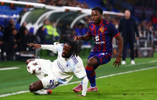 Evann Guessand of Aston Villa and Philip Otele of Basel. FC Basel v Aston Villa, UEFA Europa League, Group Stage, Football, St. Jakob-Park, Basel, Switzerland - 11 Dec 2025Basel St. Jakob-Park Switzerland EDITORIAL USE ONLY No use with unauthorised audio, video, data, fixture lists, club league logos or live services. Online in-match use limited to 120 images, no video emulation. No use in betting, games or single club league player publications. Copyright: xJamesxMarsh Shutterstockx 16080606bn