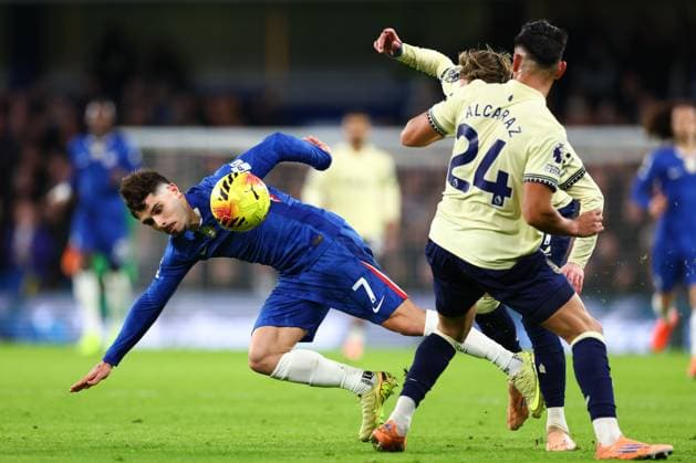 Pedro Neto of Chelsea tackled by James Garner of Everton and Carlos Alcaraz of Everton Chelsea v Everton, Premier League, Football, Stamford Bridge, London, UK - 13 Dec 2025London Stamford Bridge United Kingdom EDITORIAL USE ONLY No use with unauthorised audio, video, data, fixture lists, club league logos or live services. Online in-match use limited to 120 images, no video emulation. No use in betting, games or single club league player publications. Copyright: xSimonxDael Shutterstockx 16081503bm
