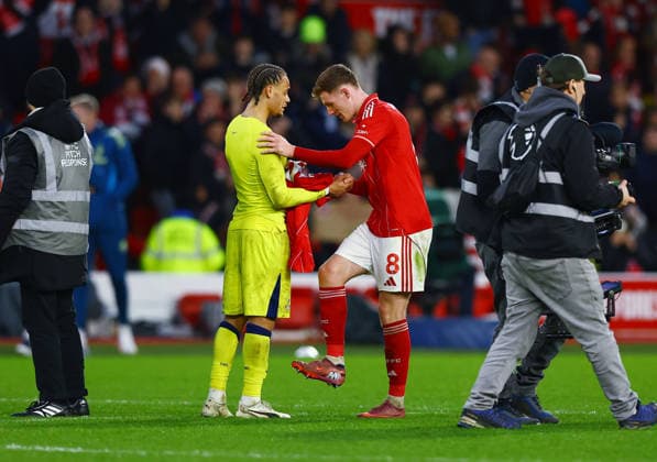 Elliot Anderson of Nottingham Forest speaks with Xavi Simons of Tottenham Hotspur at the end of the match Nottingham Forest v Tottenham Hotspur, Premier League, Football, City Ground, Nottingham, UK - 14 Dec 2025Nottingham City Ground United Kingdom EDITORIAL USE ONLY No use with unauthorised audio, video, data, fixture lists, club league logos or live services. Online in-match use limited to 120 images, no video emulation. No use in betting, games or single club league player publications. Copyright: xMattxWest Shutterstockx 16081575bn