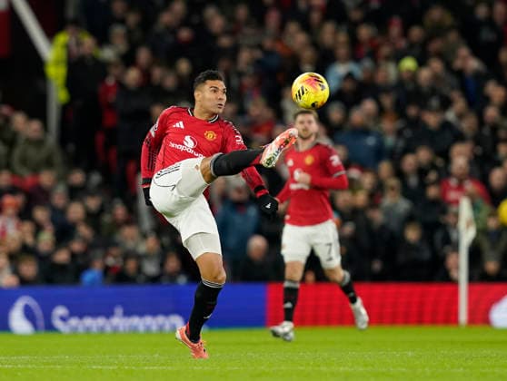 Manchester, England, 15th December 2025. Casemiro of Manchester United, ManU collects the ball during the Manchester United vs AFC Bournemouth Premier League match at Old Trafford, Manchester. Picture credit should read: Andrew Yates Sportimage EDITORIAL USE ONLY. No use with unauthorised audio, video, data, fixture lists, club league logos or live services. Online in-match use limited to 120 images, no video emulation. No use in betting, games or single club league player publications. SPI_020_AY_Man_Utd_Bmouth SPI-4379-0020
