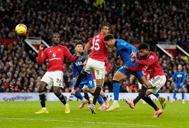Manchester, England, 15th December 2025. Marcus Tavernier of Bournemouth has header which is saved during the Manchester United, ManU vs AFC Bournemouth Premier League match at Old Trafford, Manchester. Picture credit should read: Andrew Yates Sportimage EDITORIAL USE ONLY. No use with unauthorised audio, video, data, fixture lists, club league logos or live services. Online in-match use limited to 120 images, no video emulation. No use in betting, games or single club league player publications. SPI_036_AY_Man_Utd_Bmouth SPI-4379-0036