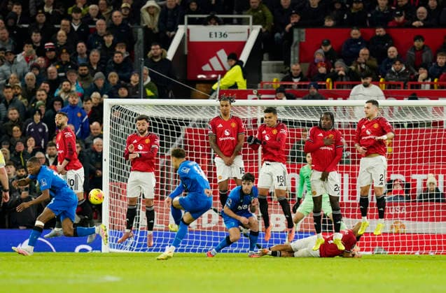 Manchester, England, 15th December 2025. Marcus Tavernier of Bournemouth scores their third goal from a free kick during the Manchester United, ManU vs AFC Bournemouth Premier League match at Old Trafford, Manchester. Picture credit should read: Andrew Yates Sportimage EDITORIAL USE ONLY. No use with unauthorised audio, video, data, fixture lists, club league logos or live services. Online in-match use limited to 120 images, no video emulation. No use in betting, games or single club league player publications. SPI_065_AY_Man_Utd_Bmouth SPI-4379-0065