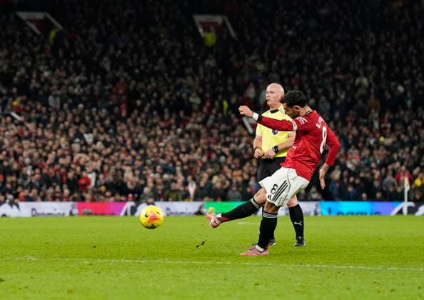 Manchester, England, 15th December 2025. Bruno Fernandes of Manchester United, ManU scores their third goal during the Manchester United vs AFC Bournemouth Premier League match at Old Trafford, Manchester. Picture credit should read: Andrew Yates Sportimage EDITORIAL USE ONLY. No use with unauthorised audio, video, data, fixture lists, club league logos or live services. Online in-match use limited to 120 images, no video emulation. No use in betting, games or single club league player publications. SPI_083_AY_Man_Utd_Bmouth SPI-4379-0084