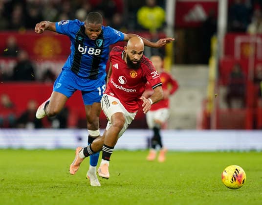 Manchester, England, 15th December 2025. Bafode Diakite of Bournemouth tussles with Bryan Mbeumo of Manchester United, ManU during the Manchester United vs AFC Bournemouth Premier League match at Old Trafford, Manchester. Picture credit should read: Andrew Yates Sportimage EDITORIAL USE ONLY. No use with unauthorised audio, video, data, fixture lists, club league logos or live services. Online in-match use limited to 120 images, no video emulation. No use in betting, games or single club league player publications. SPI_092_AY_Man_Utd_Bmouth SPI-4379-0093