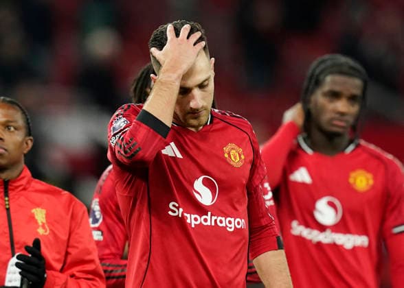 Manchester, England, 15th December 2025. Dejected Diogo Dalot of Manchester United, ManU after dropping two points during the Manchester United vs AFC Bournemouth Premier League match at Old Trafford, Manchester. Picture credit should read: Andrew Yates Sportimage EDITORIAL USE ONLY. No use with unauthorised audio, video, data, fixture lists, club league logos or live services. Online in-match use limited to 120 images, no video emulation. No use in betting, games or single club league player publications. SPI_117_AY_Man_Utd_Bmouth SPI-4379-0118