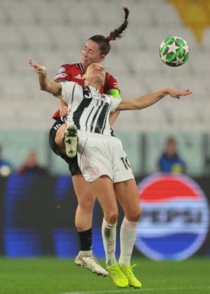Turin, Italy, 17th December 2025. Cristiana Girelli of Juventus battles for an aerial ball with Maya Le Tissier of Manchester United, ManU during the Juventus Women vs Manchester United Women UEFA Womens Champions League match at Juventus Stadium, Turin. Picture credit should read: Jonathan Moscrop Sportimage EDITORIAL USE ONLY. No use with unauthorised audio, video, data, fixture lists, club league logos or live services. Online in-match use limited to 120 images, no video emulation. No use in betting, games or single club league player publications. SPI_030_JM_JUVE_MANUTD_UWCL SPI-4364-0030