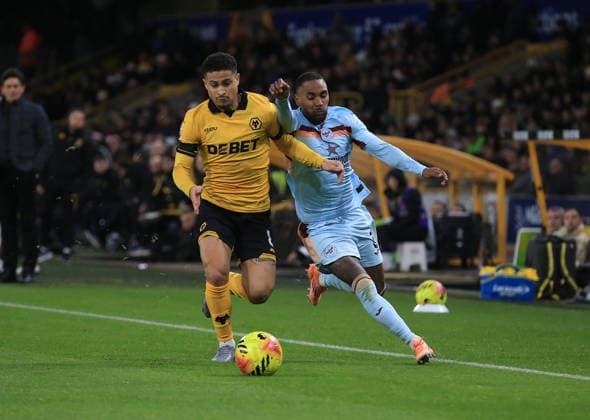 Joao Gomes of Wolverhampton Wanderers (L) vies with Rico Henry of Brentford. Wolverhampton Wanderers v Brentford, Premier League, Football, Molineux, Wolverhampton, UK - 20 Dec 2025Wolverhampton Molineux United Kingdom EDITORIAL USE ONLY No use with unauthorised audio, video, data, fixture lists, club league logos or live services. Online in-match use limited to 120 images, no video emulation. No use in betting, games or single club league player publications. Copyright: xLindseyxParnaby Shutterstockx 16148976ad
