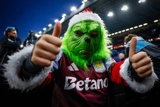 Birmingham, England, 21st December 2025. A young Aston Villa fan with a Christmas Grinch mask on during the Aston Villa vs Manchester United, ManU Premier League match at Villa Park, Birmingham. Picture credit should read: James Baylis Sportimage EDITORIAL USE ONLY. No use with unauthorised audio, video, data, fixture lists, club league logos or live services. Online in-match use limited to 120 images, no video emulation. No use in betting, games or single club league player publications. SPI_171_JB_ASTON_VILLA_MANUTD SPI-4388-0169