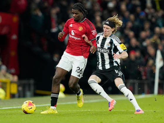 Manchester, England, 26th December 2025. Ayden Heaven of Manchester United, ManU (L) is challenged by Anthony Gordon of Newcastle United during the Manchester United vs Newcastle United Premier League match at Old Trafford, Manchester. Picture credit should read: Andrew Yates Sportimage EDITORIAL USE ONLY. No use with unauthorised audio, video, data, fixture lists, club league logos or live services. Online in-match use limited to 120 images, no video emulation. No use in betting, games or single club league player publications. SPI_013_AY_MAN_UTD_NEWC SPI-4393-0013