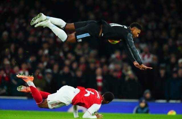 Ollie Watkins of Aston Villa goes over the top of Gabriel Magalhaes of Arsenal Arsenal v Aston Villa, Premier League, Football, Emirates Stadium, London, UK - 30 Dec 2025London Emirates Stadium United Kingdom EDITORIAL USE ONLY No use with unauthorised audio, video, data, fixture lists, club league logos or live services. Online in-match use limited to 120 images, no video emulation. No use in betting, games or single club league player publications. Copyright: xJavierxGarcia Shutterstockx 16216222s