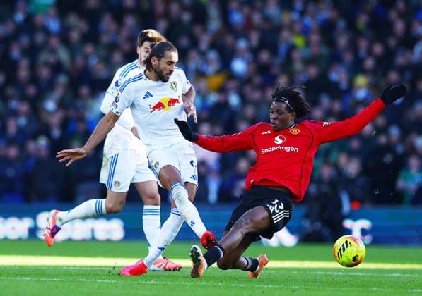 Patrick Dorgu of Manchester United, ManU receives a yellow card for this challenge on Dominic Calvert-Lewin of Leeds United Leeds United v Manchester United, Premier League, Football, Elland Road, Leeds, UK - 04 Jan 2026Leeds Elland Road United Kingdom EDITORIAL USE ONLY No use with unauthorised audio, video, data, fixture lists, club league logos or live services. Online in-match use limited to 120 images, no video emulation. No use in betting, games or single club league player publications. Copyright: xMattxWest Shutterstockx 16220514z