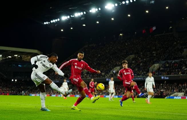 Adama Traore of Fulham crosses past Cody Gakpo and Milos Kerkez of Liverpool Fulham v Liverpool, Premier League, Football, Craven Cottage, London, UK - 04 Jan 2026London Craven Cottage United Kingdom EDITORIAL USE ONLY No use with unauthorised audio, video, data, fixture lists, club league logos or live services. Online in-match use limited to 120 images, no video emulation. No use in betting, games or single club league player publications. Copyright: xJavierxGarcia Shutterstockx 16220531cu