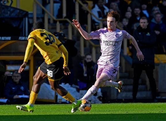 Tommy McDermott of Shrewsbury Town in action with Jackson Tchatchoua of Wolverhampton Wanderers Wolverhampton Wanderers v Shrewsbury Town, Emirates FA Cup, Third Round, Football, Molineux, Wolverhampton, UK - 10 Jan 2026Wolverhampton Molineux United Kingdom EDITORIAL USE ONLY No use with unauthorised audio, video, data, fixture lists, club league logos or live services. Online in-match use limited to 120 images, no video emulation. No use in betting, games or single club league player publications. Copyright: xAlanxWalter Shutterstockx 16246186n
