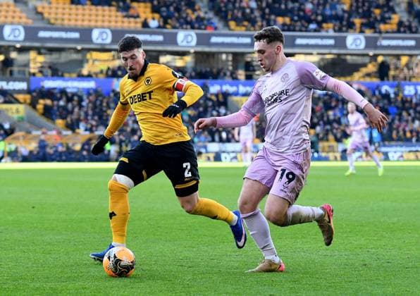 Matt Doherty of Wolverhampton Wanderers in action with Iwan Morgan of Shrewsbury Town Wolverhampton Wanderers v Shrewsbury Town, Emirates FA Cup, Third Round, Football, Molineux, Wolverhampton, UK - 10 Jan 2026Wolverhampton Molineux United Kingdom EDITORIAL USE ONLY No use with unauthorised audio, video, data, fixture lists, club league logos or live services. Online in-match use limited to 120 images, no video emulation. No use in betting, games or single club league player publications. Copyright: xAlanxWalter Shutterstockx 16246186w