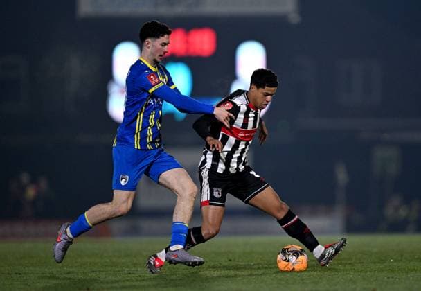 Charlie Cummins of Weston-super-Mare and Evan Khouri of Grimsby Town Grimsby Town v Weston Super Mare, Emirates FA Cup, Third Round, Football, Blundell Park, Grimsby, UK - 10 Jan 2026Grimsby Blundell Park United Kingdom EDITORIAL USE ONLY No use with unauthorised audio, video, data, fixture lists, club league logos or live services. Online in-match use limited to 120 images, no video emulation. No use in betting, games or single club league player publications. Copyright: xAnnaxGowthorpe Shutterstockx 16246310av