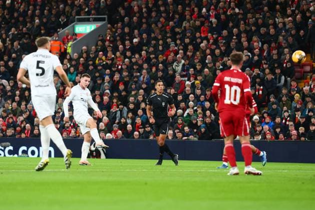 Giorgi Mamardashvili of Liverpool saves a shot from Jonathan Bland of Barnsley Liverpool v Barnsley, Emirates FA Cup, Third Round, Football, Anfield, Liverpool, UK - 12 Jan 2026Liverpool Anfield United Kingdom EDITORIAL USE ONLY No use with unauthorised audio, video, data, fixture lists, club league logos or live services. Online in-match use limited to 120 images, no video emulation. No use in betting, games or single club league player publications. Copyright: xPaulxCurrie Shutterstockx 16246339an