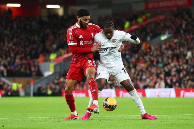 Joe Gomez of Liverpool and Reyes Cleary of Barnsley Liverpool v Barnsley, Emirates FA Cup, Third Round, Football, Anfield, Liverpool, UK - 12 Jan 2026Liverpool Anfield United Kingdom EDITORIAL USE ONLY No use with unauthorised audio, video, data, fixture lists, club league logos or live services. Online in-match use limited to 120 images, no video emulation. No use in betting, games or single club league player publications. Copyright: xPaulxCurrie Shutterstockx 16246339bl