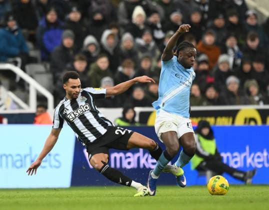 Jacob Murphy of Newcastle United challenges Jeremy Doku of Manchester City Newcastle United v Manchester City, EFL Carabao Cup, Semi Final, First Leg, Football, St James Park, Newcastle, UK - 13 Jan 2026Newcastle St James Park United Kingdom EDITORIAL USE ONLY No use with unauthorised audio, video, data, fixture lists, club league logos or live services. Online in-match use limited to 120 images, no video emulation. No use in betting, games or single club league player publications. Copyright: xRichardxLee Shutterstockx 16302979bg