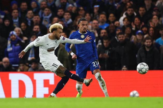 Jaja of Pafos with a shot on goal under pressure from Malo Gusto of Chelsea Chelsea v Pafos, UEFA Champions League, Group Stage, Football, Stamford Bridge, London, UK - 21 Jan 2026London Stamford Bridge United Kingdom EDITORIAL USE ONLY No use with unauthorised audio, video, data, fixture lists, club league logos or live services. Online in-match use limited to 120 images, no video emulation. No use in betting, games or single club league player publications. Copyright: xSimonxDael Shutterstockx 16348356q
