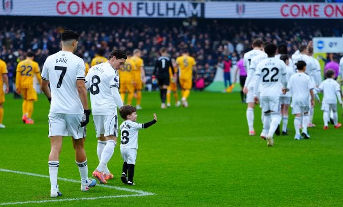 Harry Wilson of Fulham walks out with his son Fulham v Brighton and Hove Albion, Premier League, Football, Craven Cottage, London, UK - 24 Jan 2026London Craven Cottage United Kingdom EDITORIAL USE ONLY No use with unauthorised audio, video, data, fixture lists, club league logos or live services. Online in-match use limited to 120 images, no video emulation. No use in betting, games or single club league player publications. Copyright: xJavierxGarcia Shutterstockx 16425974ex