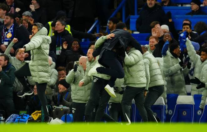 Chelsea manager Liam Rosenior jumps into the arms of his coaching staff after Enzo Fernandez scored a goal to make it 3-2 Chelsea v West Ham United, Premier League, Football, Stamford Bridge, London, UK - 31 Jan 2026London Stamford Bridge United Kingdom EDITORIAL USE ONLY No use with unauthorised audio, video, data, fixture lists, club league logos or live services. Online in-match use limited to 120 images, no video emulation. No use in betting, games or single club league player publications. Copyright: xJavierxGarcia Shutterstockx 16496749ar