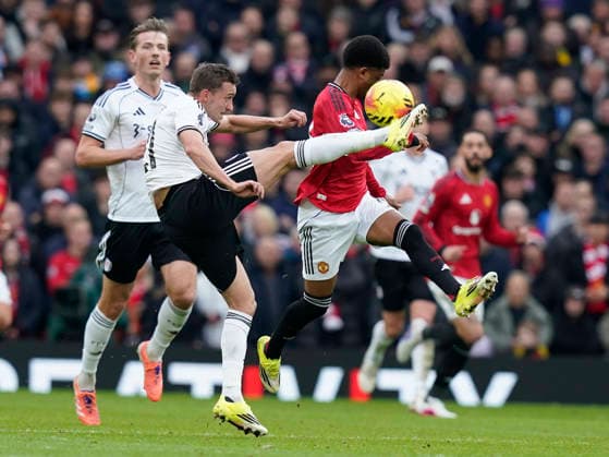Manchester, England, 1st February 2026. Timothy Castagne of Fulham (L) challenges Amad Diallo of Manchester United, ManU during the Manchester United vs Fulham Premier League match at Old Trafford, Manchester. Picture credit should read: Andrew Yates Sportimage EDITORIAL USE ONLY. No use with unauthorised audio, video, data, fixture lists, club league logos or live services. Online in-match use limited to 120 images, no video emulation. No use in betting, games or single club league player publications. SPI_029_AY_MAN_UTD_FULHAM SPI-4502-0028