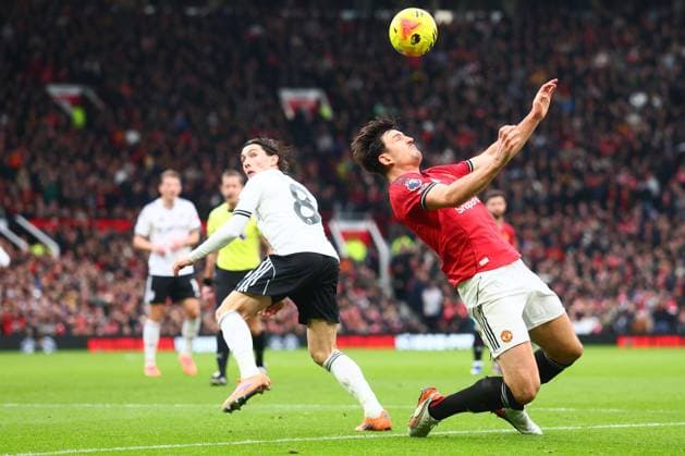 Harry Wilson of Fulham and Harry Maguire of Manchester United, ManU Manchester United v Fulham, Premier League, Football, Old Trafford, Manchester, UK - 01 Feb 2026Manchester Old Trafford United Kingdom EDITORIAL USE ONLY No use with unauthorised audio, video, data, fixture lists, club league logos or live services. Online in-match use limited to 120 images, no video emulation. No use in betting, games or single club league player publications. Copyright: xPaulxCurrie Shutterstockx 16496861ea