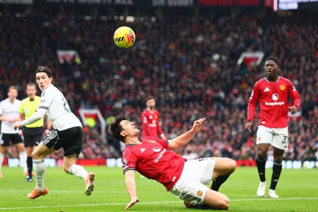 Harry Wilson of Fulham and Harry Maguire of Manchester United, ManU Manchester United v Fulham, Premier League, Football, Old Trafford, Manchester, UK - 01 Feb 2026Manchester Old Trafford United Kingdom EDITORIAL USE ONLY No use with unauthorised audio, video, data, fixture lists, club league logos or live services. Online in-match use limited to 120 images, no video emulation. No use in betting, games or single club league player publications. Copyright: xPaulxCurrie Shutterstockx 16496861eb