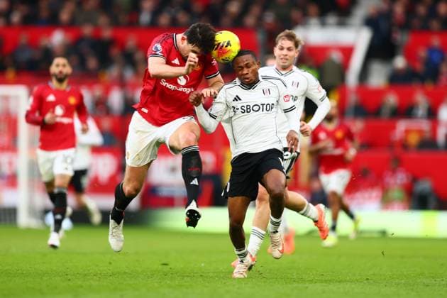 Harry Maguire of Manchester United, ManU and Samuel Chukwueze of Fulham Manchester United v Fulham, Premier League, Football, Old Trafford, Manchester, UK - 01 Feb 2026Manchester Old Trafford United Kingdom EDITORIAL USE ONLY No use with unauthorised audio, video, data, fixture lists, club league logos or live services. Online in-match use limited to 120 images, no video emulation. No use in betting, games or single club league player publications. Copyright: xPaulxCurrie Shutterstockx 16496861ek