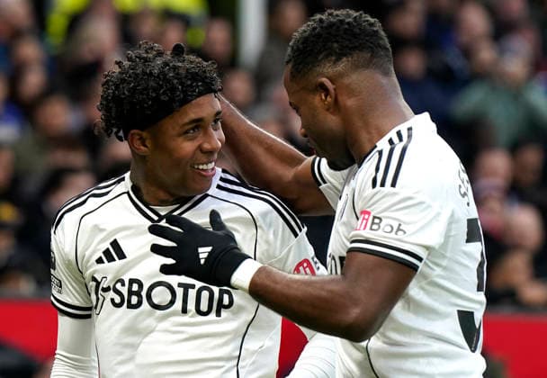 Manchester, England, 1st February 2026. Kevin of Fulham (L) celebrates after scoring with Ryan Sessegnon of Fulham during the Manchester United, ManU vs Fulham Premier League match at Old Trafford, Manchester. Picture credit should read: Andrew Yates Sportimage EDITORIAL USE ONLY. No use with unauthorised audio, video, data, fixture lists, club league logos or live services. Online in-match use limited to 120 images, no video emulation. No use in betting, games or single club league player publications. SPI_039_AY_MAN_UTD_FULHAM SPI-4502-0038
