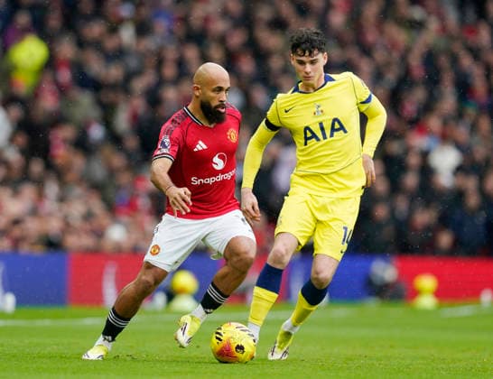 Manchester, England, 7th February 2026. Archie Gray of Tottenham tussles with Bryan Mbeumo of Manchester United, ManU before the Manchester United vs Tottenham Hotspur Premier League match at Old Trafford, Manchester. Picture credit should read: Andrew Yates Sportimage EDITORIAL USE ONLY. No use with unauthorised audio, video, data, fixture lists, club league logos or live services. Online in-match use limited to 120 images, no video emulation. No use in betting, games or single club league player publications. SPI_036_AY_Man_Utd_Spurs SPI-4511-0036