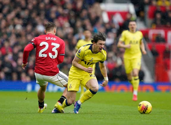 Manchester, England, 7th February 2026. Luke Shaw of Manchester United, ManU tackles Connor Gallagher of Tottenham before the Manchester United vs Tottenham Hotspur Premier League match at Old Trafford, Manchester. Picture credit should read: Andrew Yates Sportimage EDITORIAL USE ONLY. No use with unauthorised audio, video, data, fixture lists, club league logos or live services. Online in-match use limited to 120 images, no video emulation. No use in betting, games or single club league player publications. SPI_039_AY_Man_Utd_Spurs SPI-4511-0039