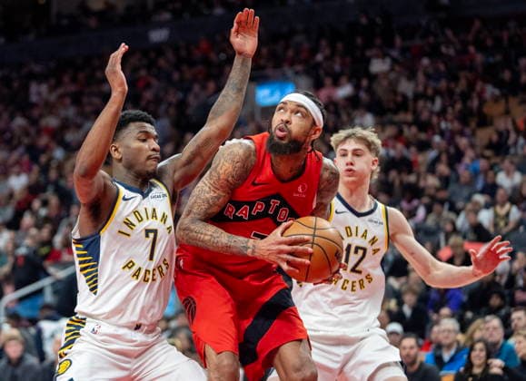 February 8, 2026, Toronto, On, Canada: Toronto Raptors forward Brandon Ingram (centre) works his way to the hoop past Indiana Pacers guard Kam Jones (7) and Johnny Furphy (12) during second half NBA, Basketball Herren, USA action in Toronto, Sunday, Feb. 8, 2026. Canada News - February 8, 2026 - ZUMAc35_ 20260208_zaf_c35_206 Copyright: xFrankxGunnx