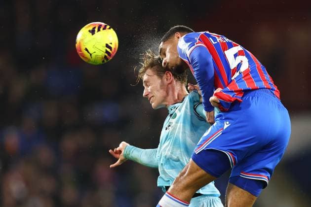 Maxence Lacroix of Crystal Palace heads clear under pressure from Zian Flemming of Burnley Crystal Palace v Burnley, Premier League, Football, Selhurst Park, London, UK - 11 Feb 2026London Selhurst Park United Kingdom EDITORIAL USE ONLY No use with unauthorised audio, video, data, fixture lists, club league logos or live services. Online in-match use limited to 120 images, no video emulation. No use in betting, games or single club league player publications. Copyright: xSimonxDael Shutterstockx 16540342ab