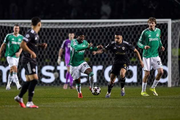 Anthony Elanga of Newcastle United Football Club runs with the ball as he is pressed by Leandro Andrade of Qarabag FK Qarabag v Newcastle United, UEFA Champions League, Knockout Round Play-Offs, First Leg, Football, Tofig Bahramov Republican Stadium, Baku, Azerbaijan - 18 Feb 2026Baku Tofig Bahramov Republican Stadiu Azerbaijan EDITORIAL USE ONLY No use with unauthorised audio, video, data, fixture lists, club league logos or live services. Online in-match use limited to 120 images, no video emulation. No use in betting, games or single club league player publications. Copyright: xElmirxKarimov Shutterstockx 16660416ak
