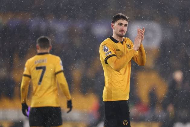 Santiago Bueno of Wolverhampton Wanderers and Andre at the end of the match Wolverhampton Wanderers v Arsenal, Premier League, Football, Molineux, Wolverhampton, UK - 18 Feb 2026Wolverhampton Molineux United Kingdom EDITORIAL USE ONLY No use with unauthorised audio, video, data, fixture lists, club league logos or live services. Online in-match use limited to 120 images, no video emulation. No use in betting, games or single club league player publications. Copyright: xRyanxBrowne Shutterstockx 16660426fg
