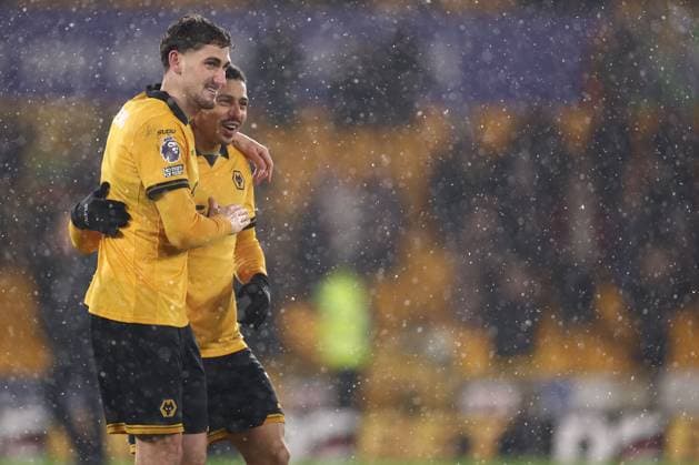 Santiago Bueno of Wolverhampton Wanderers and Andre at the end of the match Wolverhampton Wanderers v Arsenal, Premier League, Football, Molineux, Wolverhampton, UK - 18 Feb 2026Wolverhampton Molineux United Kingdom EDITORIAL USE ONLY No use with unauthorised audio, video, data, fixture lists, club league logos or live services. Online in-match use limited to 120 images, no video emulation. No use in betting, games or single club league player publications. Copyright: xRyanxBrowne Shutterstockx 16660426fe