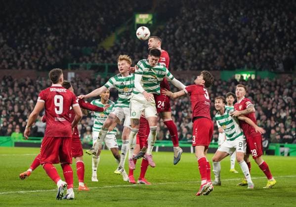 Jeff Chabot of Stuttgart heads the ball clear above Tomas Cvancara of Celtic. Celtic v Stuttgart, UEFA Europa League, Knockout Round Play Offs, First Leg, Football, Celtic Park, Glasgow, Scotland, UK - 19 Feb 2026Glasgow Celtic Park Scotland United Kingdom EDITORIAL USE ONLY No use with unauthorised audio, video, data, fixture lists, club league logos or live services. Online in-match use limited to 120 images, no video emulation. No use in betting, games or single club league player publications. Copyright: xStuartxWallace Shutterstockx 16674319bt
