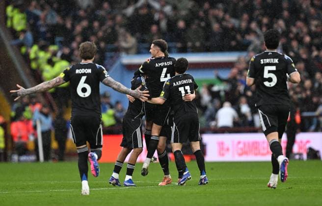 Anton Stach of Leeds United celebrates with team mates after scoring the team s first goal Aston Villa v Leeds United, Premier League, Football, Villa Park, Birmingham, UK - 21 Feb 2026Birmingham Villa Park United Kingdom EDITORIAL USE ONLY No use with unauthorised audio, video, data, fixture lists, club league logos or live services. Online in-match use limited to 120 images, no video emulation. No use in betting, games or single club league player publications. Copyright: xAnnaxGowthorpe Shutterstockx 16681467p