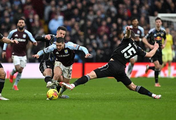 Emi Buendia of Aston Villa is tackled by Ethan Ampadu and Jaka Bijol of Leeds United Aston Villa v Leeds United, Premier League, Football, Villa Park, Birmingham, UK - 21 Feb 2026Birmingham Villa Park United Kingdom EDITORIAL USE ONLY No use with unauthorised audio, video, data, fixture lists, club league logos or live services. Online in-match use limited to 120 images, no video emulation. No use in betting, games or single club league player publications. Copyright: xAnnaxGowthorpe Shutterstockx 16681467u