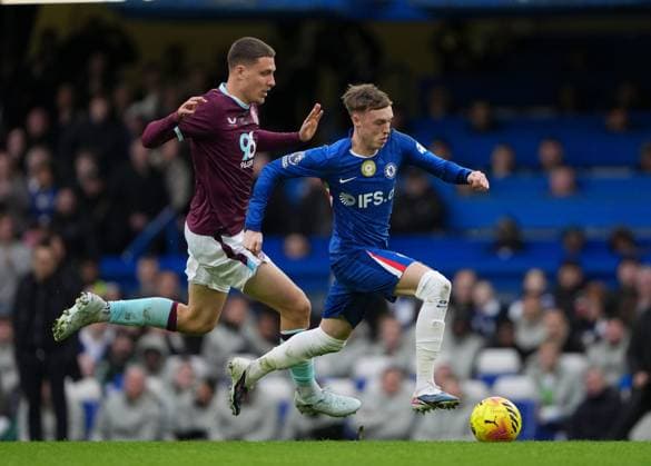 Cole Palmer of Chelsea runs away from Maxime Esteve of Burnley Chelsea v Burnley, Premier League, Football, Stamford Bridge, London, UK - 21 Feb 2026London Stamford Bridge United Kingdom EDITORIAL USE ONLY No use with unauthorised audio, video, data, fixture lists, club league logos or live services. Online in-match use limited to 120 images, no video emulation. No use in betting, games or single club league player publications. Copyright: xJedxLeicester Shutterstockx 16681483ac