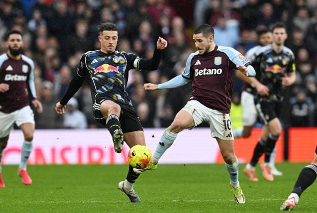 Ethan Ampadu of Leeds United and Emi Buendia of Aston Villa Aston Villa v Leeds United, Premier League, Football, Villa Park, Birmingham, UK - 21 Feb 2026Birmingham Villa Park United Kingdom EDITORIAL USE ONLY No use with unauthorised audio, video, data, fixture lists, club league logos or live services. Online in-match use limited to 120 images, no video emulation. No use in betting, games or single club league player publications. Copyright: xAnnaxGowthorpe Shutterstockx 16681467be