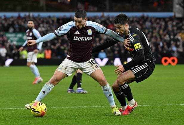 Emi Buendia of Aston Villa and Ilia Gruev of Leeds United Aston Villa v Leeds United, Premier League, Football, Villa Park, Birmingham, UK - 21 Feb 2026Birmingham Villa Park United Kingdom EDITORIAL USE ONLY No use with unauthorised audio, video, data, fixture lists, club league logos or live services. Online in-match use limited to 120 images, no video emulation. No use in betting, games or single club league player publications. Copyright: xAnnaxGowthorpe Shutterstockx 16681467bp