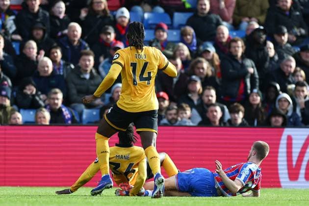 Adam Wharton of Crystal Palace concedes a penalty for a foul on Mateus Mane of Wolverhampton Wanderers Crystal Palace v Wolverhampton Wanderers, Premier League, Football, Selhurst Park, London, UK - 22 Feb 2026London Selhurst Park United Kingdom EDITORIAL USE ONLY No use with unauthorised audio, video, data, fixture lists, club league logos or live services. Online in-match use limited to 120 images, no video emulation. No use in betting, games or single club league player publications. Copyright: xSimonxDael Shutterstockx 16681548w