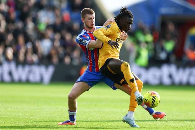 Mateus Mane of Wolverhampton Wanderers holds off Adam Wharton of Crystal Palace Crystal Palace v Wolverhampton Wanderers, Premier League, Football, Selhurst Park, London, UK - 22 Feb 2026London Selhurst Park United Kingdom EDITORIAL USE ONLY No use with unauthorised audio, video, data, fixture lists, club league logos or live services. Online in-match use limited to 120 images, no video emulation. No use in betting, games or single club league player publications. Copyright: xSimonxDael Shutterstockx 16681548ap