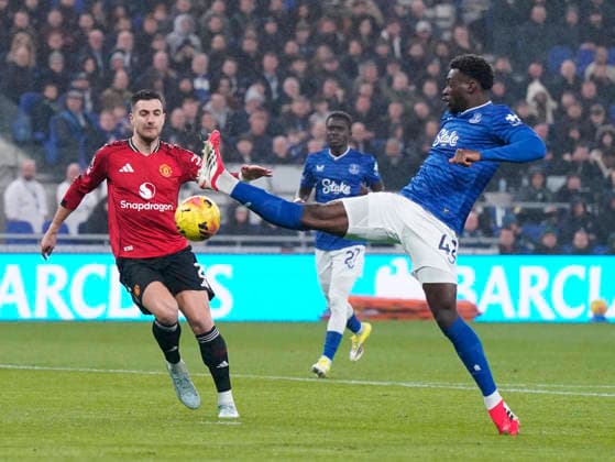 Liverpool, England, 23rd February 2026. Diogo Dalot of Manchester United, ManU intercepts Tim Iroegbunam of Everton during the Everton vs Manchester United Premier League match at Hill Dickinson Stadium, Liverpool. Picture credit should read: Andrew Yates Sportimage EDITORIAL USE ONLY. No use with unauthorised audio, video, data, fixture lists, club league logos or live services. Online in-match use limited to 120 images, no video emulation. No use in betting, games or single club league player publications. SPI_016_AY_Everton_Man_Utd SPI-4547-0015